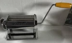 Darice Manual Pasta Maker Silver Metal With Yellow Plastic Handle, 2-PIECE Set. Fixed Price $27.00.